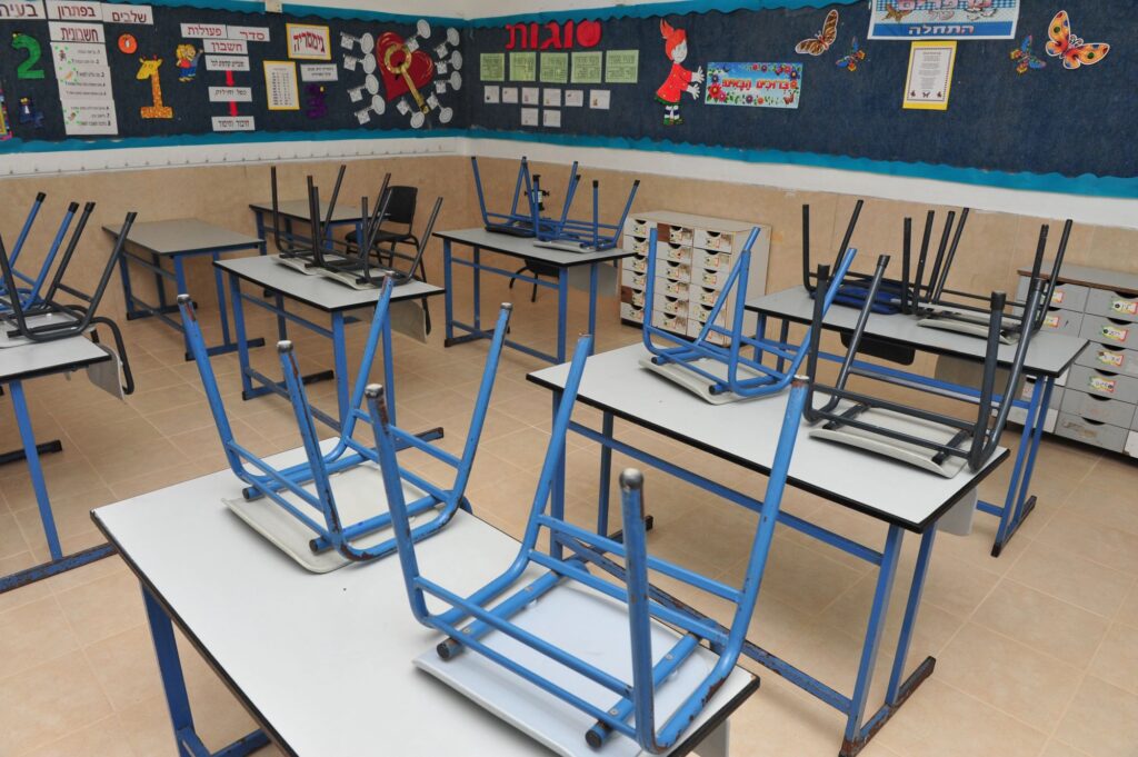 Empty class with reversed chairs