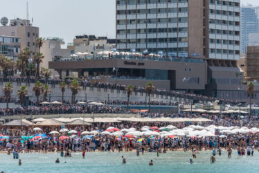 Israel, Tel Aviv-Yafo - 19 April 2018: Crowd watching the elebration of the 70th independence day of Israel - Yom haatzmaout - airshow of of the Israeli air force - aerobatics (Photo by Michael Jacobs/Art in All of Us/Corbis via Getty Images)