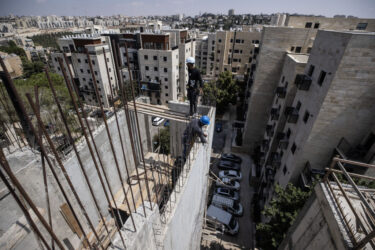 JERUSALEM - AUGUST 29: Intensive construction works being carried out on older buildings in the Ramat Eshkol neighborhood of West Jerusalem on 29 באוגוסט 2024. In Israel, recent building regulations mandate that all new constructions include shelters, resulting in every new building and apartment being equipped with them. However, older buildings constructed before this regulation lack shelters. In response to the ongoing attacks on Gaza since October 7 and escalating tensions with Iran and Hezbollah, shelters are now being retrofitted into these older structures. (Photo by Mostafa Alkharouf/Anadolu via Getty Images)