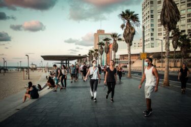 Tel Aviv Israel October 04, 2020 View of unidentified people without a face mask to protect themself walking on Herbert Samuel Promenade in Tel Aviv during lockdown and Coronavirus outbreak