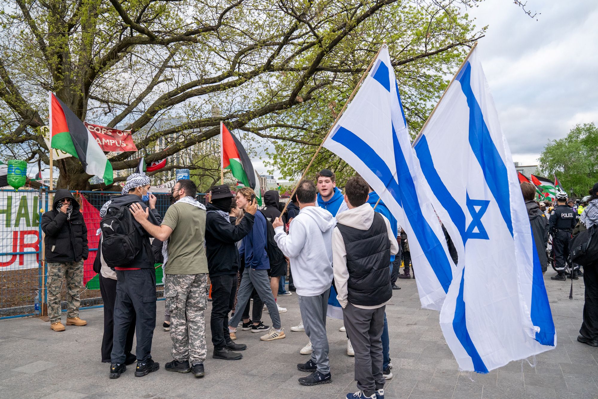 Jewish students have heated exchange with pro-Palestinian protesters outside the student encampment occupying King's College Circle at the University of Toronto.